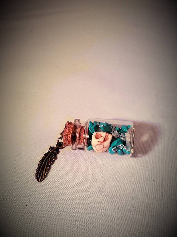 Turquoise skull gram of silver