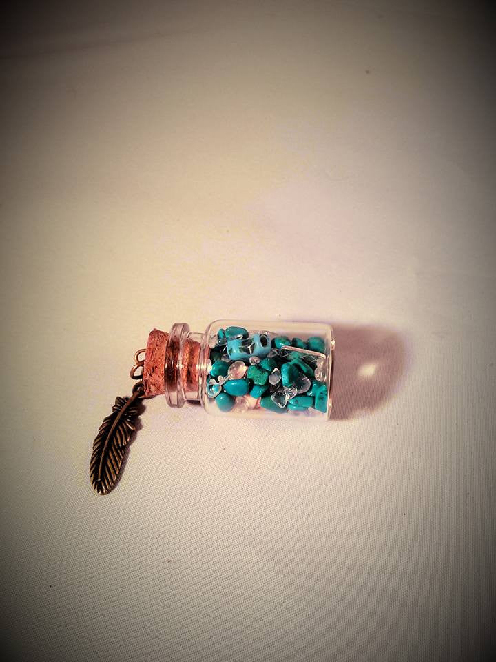 Turquoise skull gram of silver